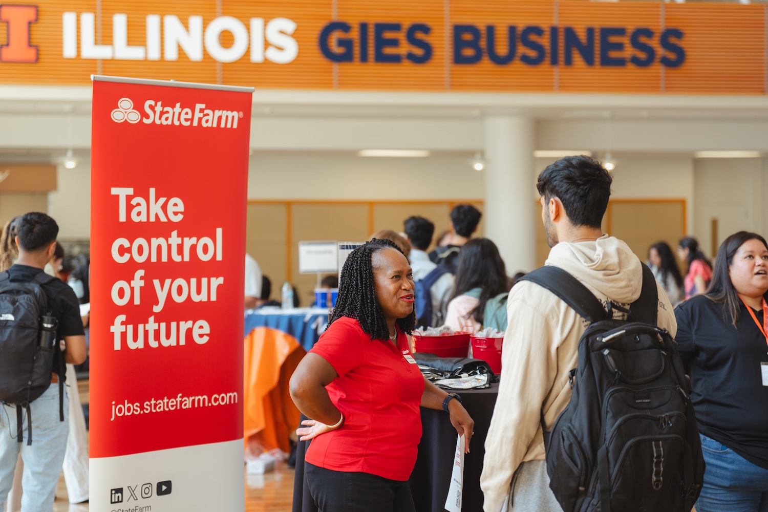 State Farm Employee Talking to Student at Job Fair
