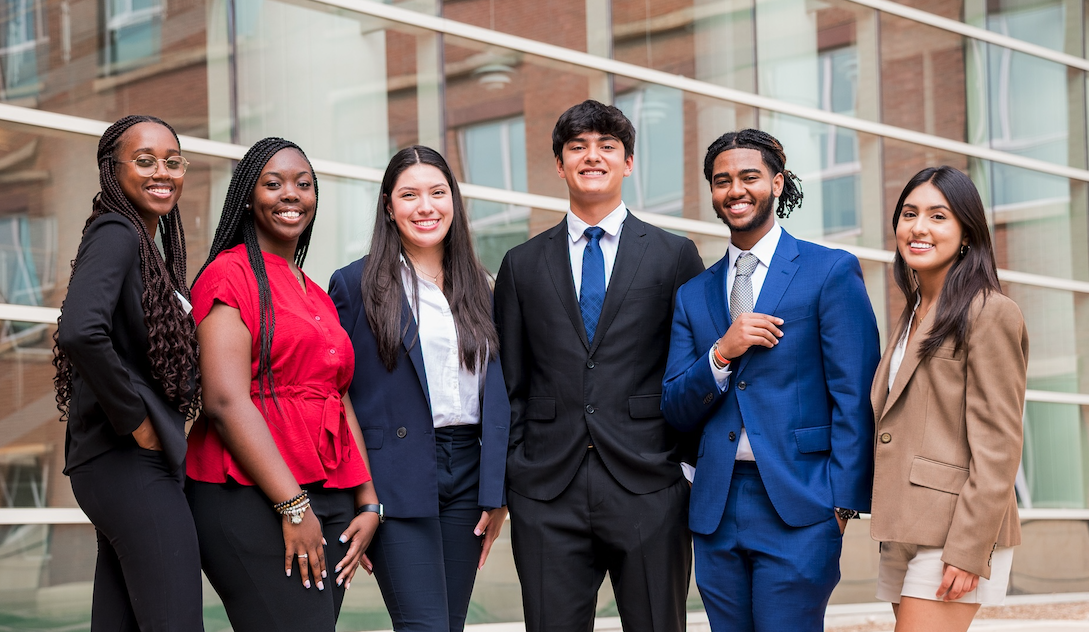 Gies Business students standing outside of BIF smiling.