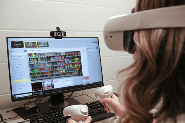 Research participant engaging in virtual reality research in front of computer