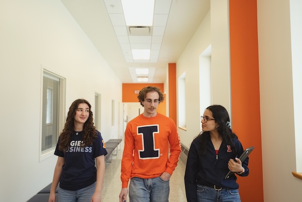 Gies Business students talking with an advisor.