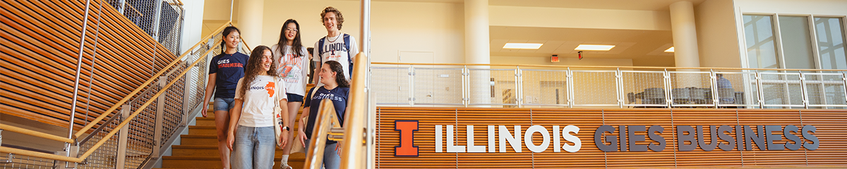 Gies Business Students on Talking and Walking Down Stairs in Business Instructional Facility