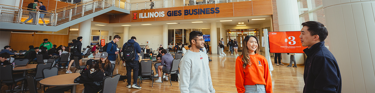 Graduate students talking in the BIF atrium