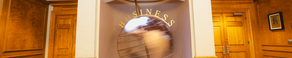 Large globe with business spelled out above it in Wohlers Hall