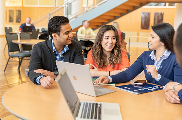 Graduate students working on a project